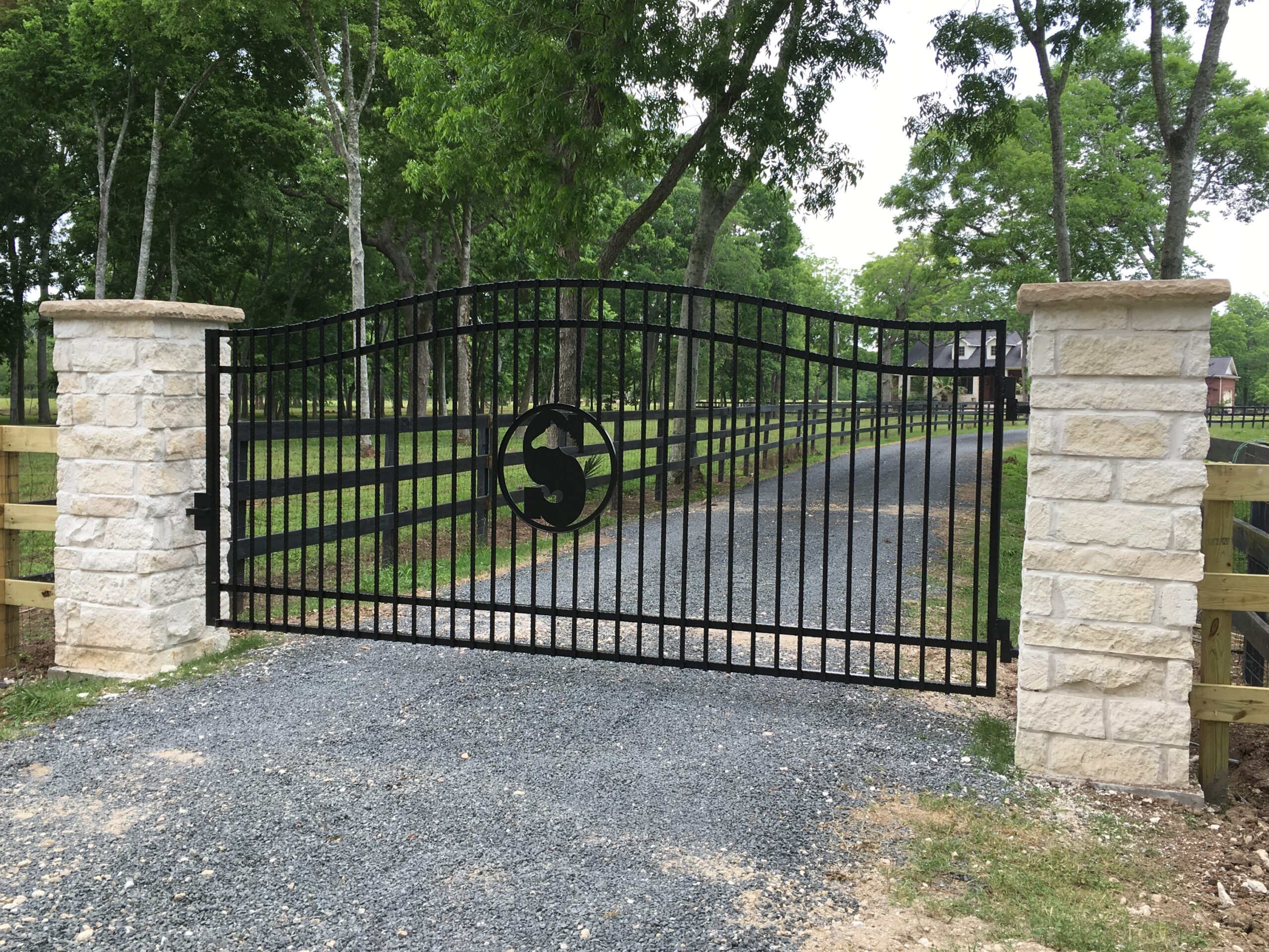 Custom entry gate with stone columns