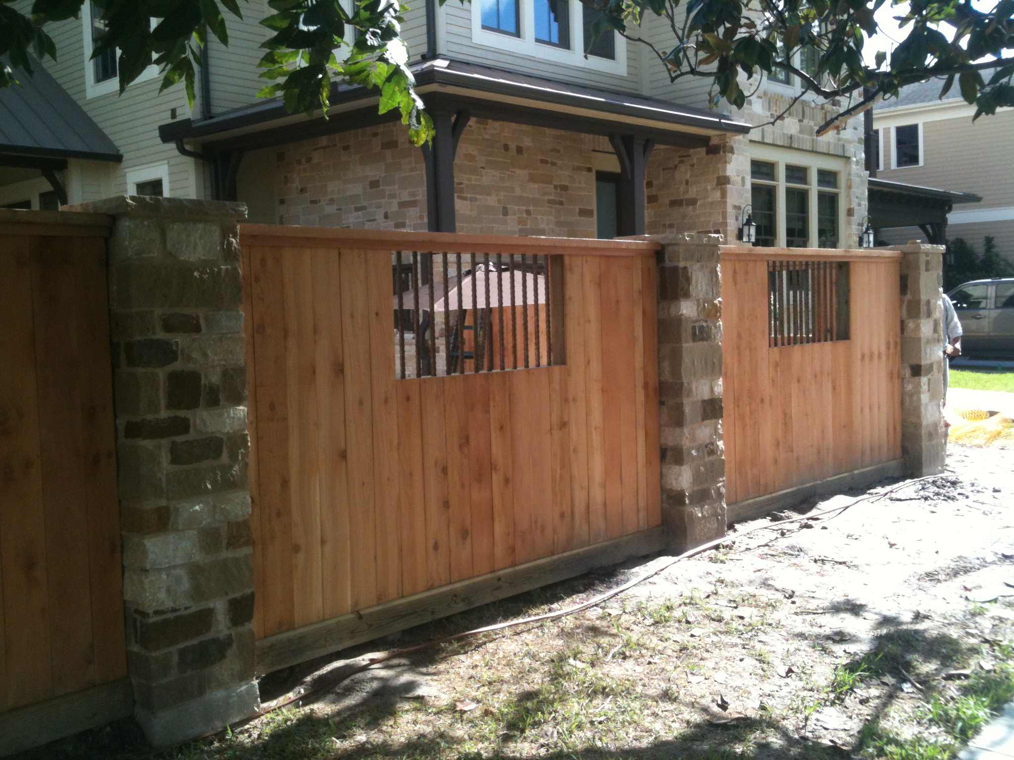 Wood fence with brick columns